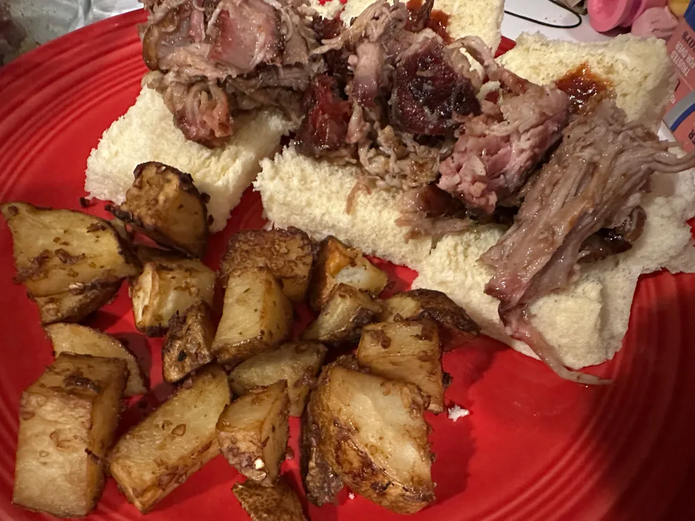 Pulled pork served on Hawaiian Rolls with a side of roasted potatoes