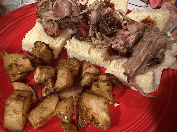 Pulled pork served on Hawaiian Rolls with a side of roasted potatoes